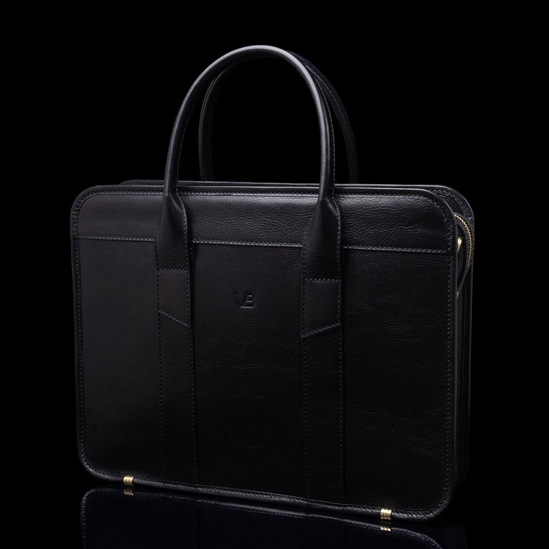 Von Baer exquisite luxury full-grain leather laptop briefcase for women and men in black color, half-turned 3D view.