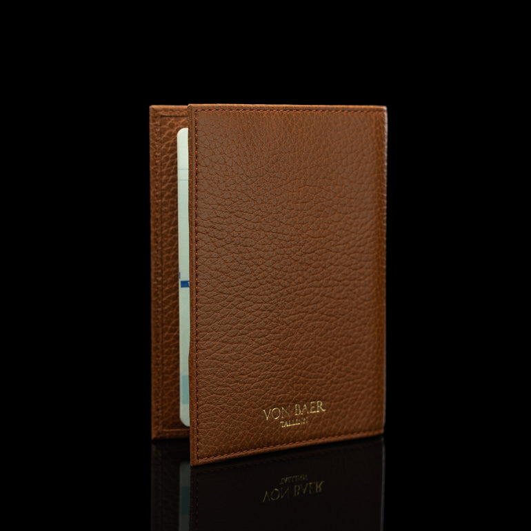 Von Baer full grain leather passport cover holder, half-turned view on a black background