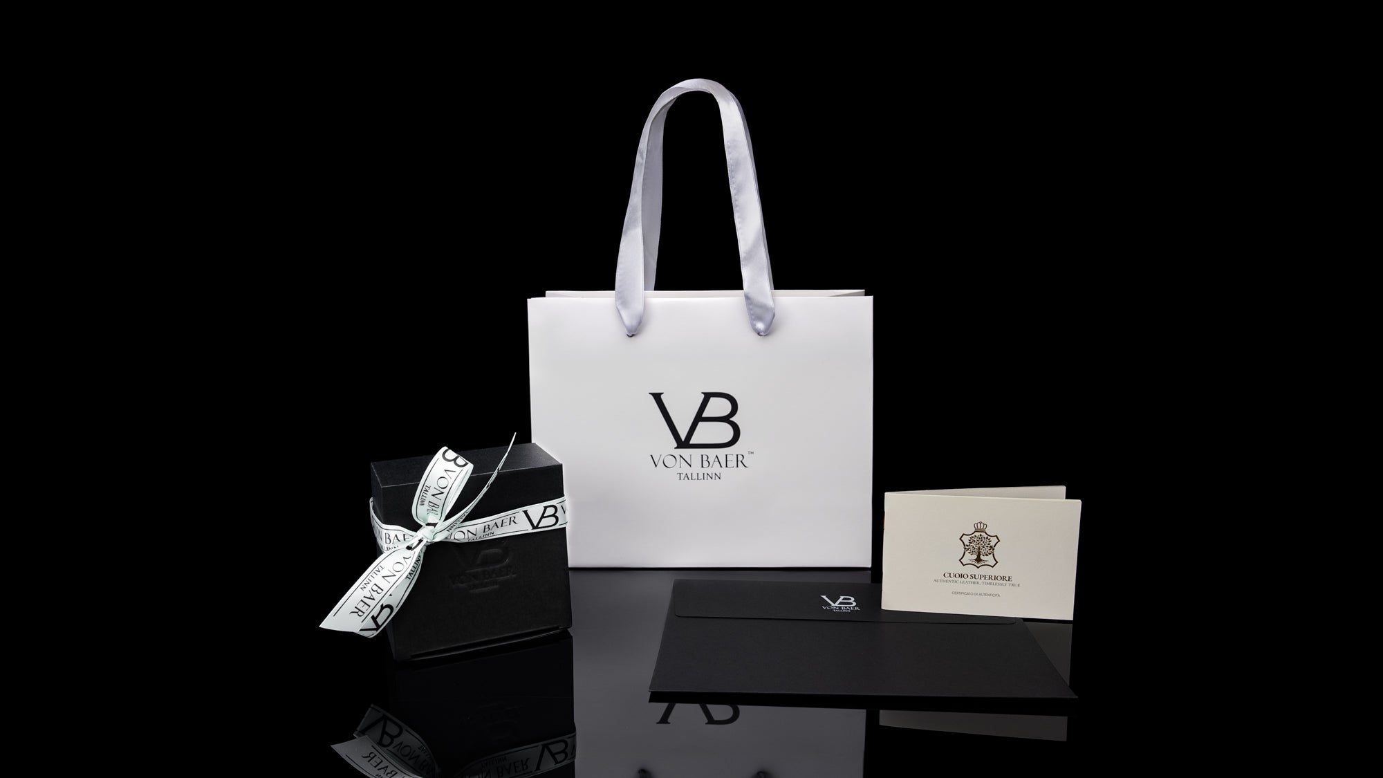 Von Baer gift packaging with leather belts and certificate, slider.
