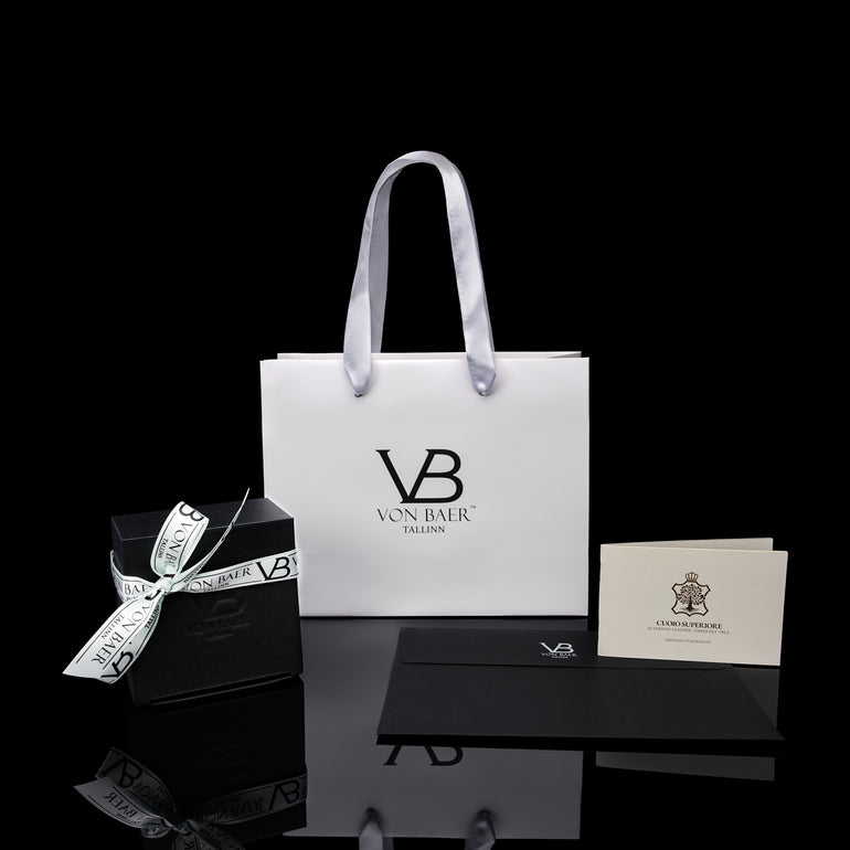Von Baer gift packaging with leather belts and certificate.