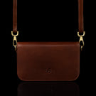 Von Baer Isabella small leather shoulder bag with adjustable strap in brown, front view.