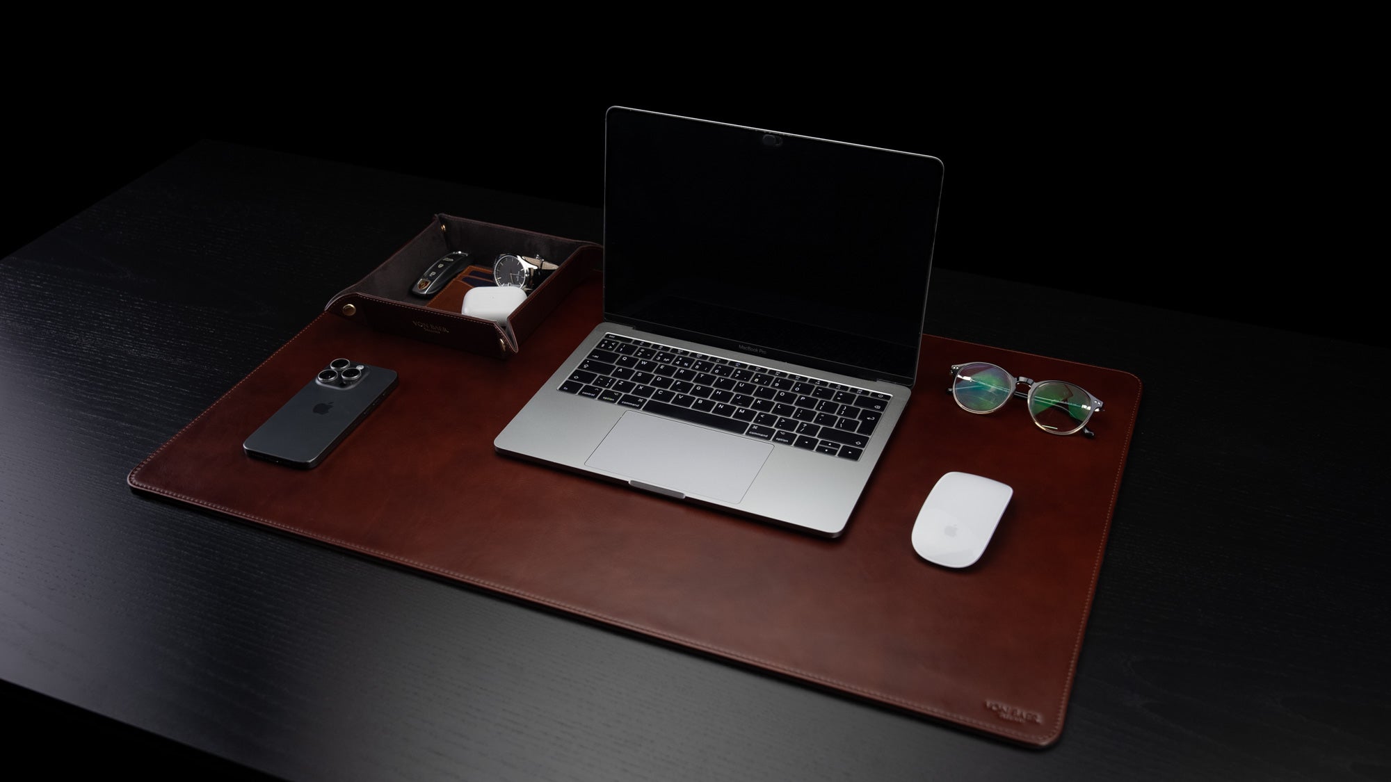 Von Baer Executive large luxury leather desk mat in brown, featuring a side view with a MacBook placed on top.