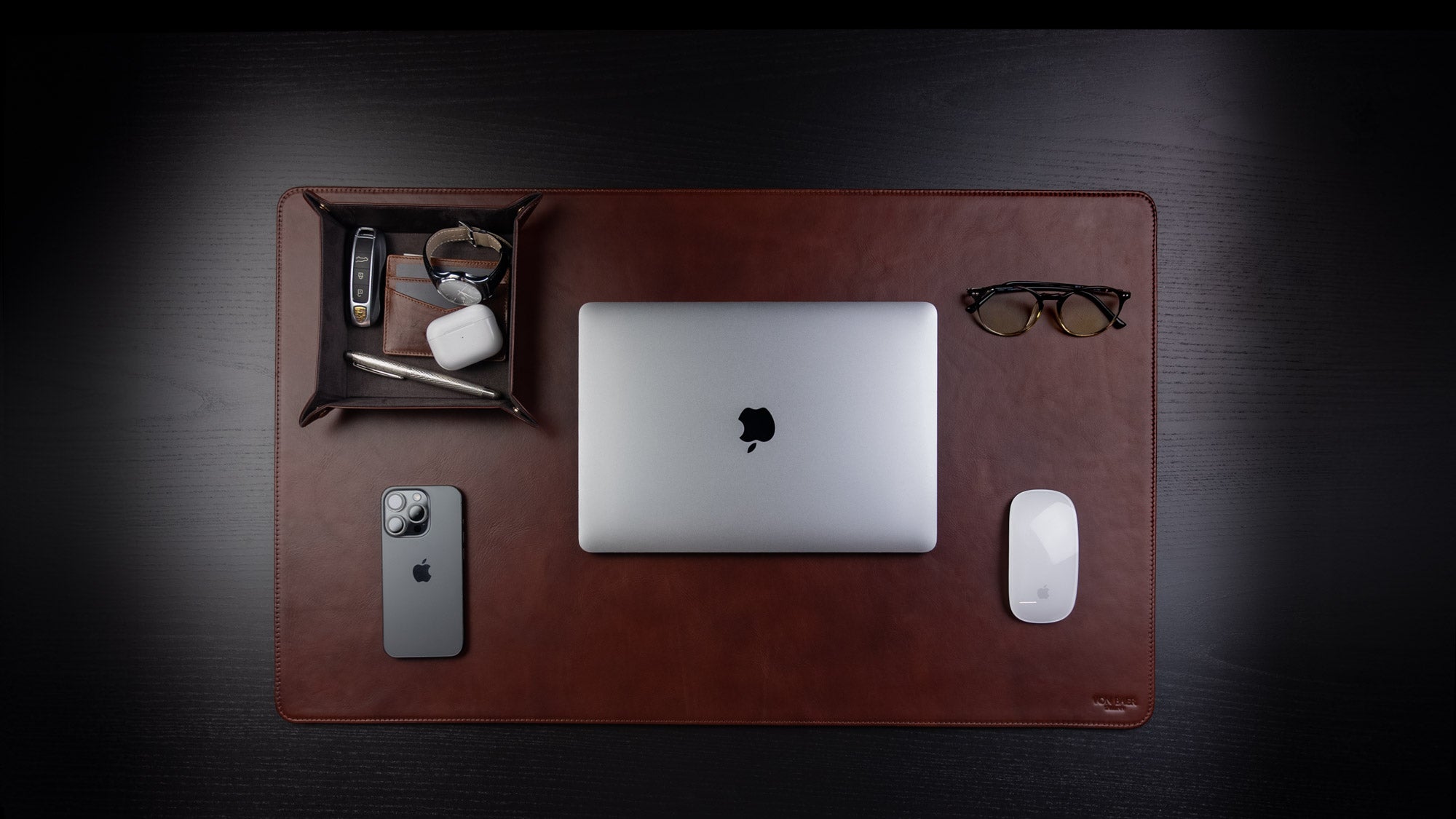 Von Baer large luxury leather desk mat in high-quality brown, featuring an upper view with a MacBook placed as a stylish gift idea.