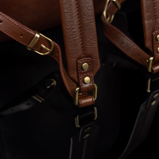 Von Baer Liberty men's full-grain leather backpack with brass details, close-up showing premium hardware and refined craftsmanship.
