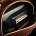 Von Baer Liberty women's leather backpack inside view showing laptop compartment with MacBook and other essentials