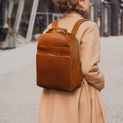 Von Baer Liberty women's stylish Italian leather backpack in tan, worn by a female model, highlighting its elegant and fashionable design.