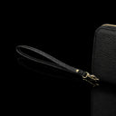 Von Baer origin luxury RFID men’s leather wallet in cognac tan with wrist strap, close-up showing premium detail.