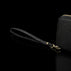 Von Baer origin luxury RFID men’s leather wallet in cognac tan with wrist strap, close-up showing premium detail.