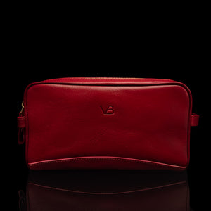Von Baer superior luxury full-grain leather women's toiletry bag in red, front view.
