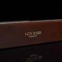 Von Baer Tallinn Majestic luxury Italian leather tray desk organizer, catch-all in brown, showcasing the golden logo close-up, exuding elegance and sophistication.