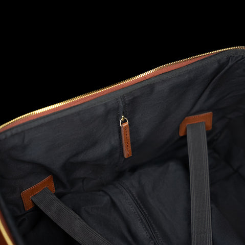 Interior view of the Von Baer Voyager women's luxury leather carry on bag, showing the service zipper for the handle mechanism