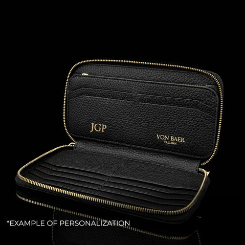 Von Baer origin luxury large men’s leather wallet with personalized embossed initials, example of customization.