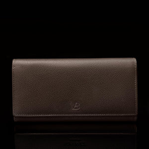 A front view of the W1 Plus dark brown leather wallet with the Von Baer logo.