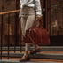 Weekender Womens Leather Weekend Bag solid brown with model