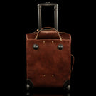 voyager leather carry on bag with wheels solid brown back view with wheels drawer out
